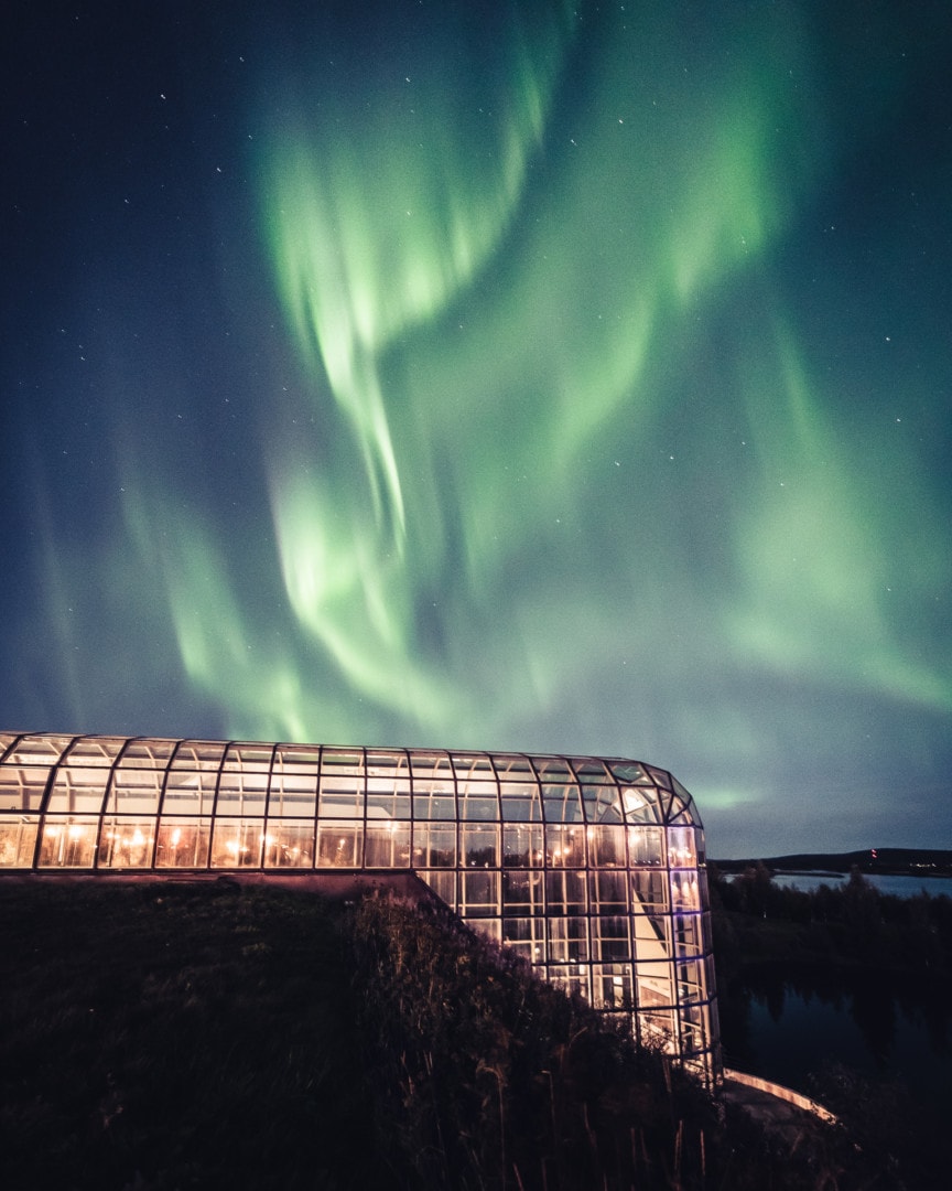 Beautiful northern lights near the Arktikum Museum in Rovaniemi Lapland Finland. Photo by Alexander Kuznetsov / Aurora Hunting.