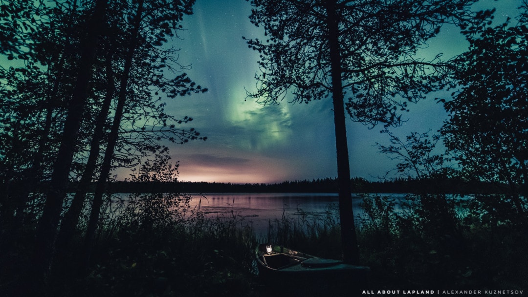 Northern lights over the lake in Rovaniemi Lapland Finland.