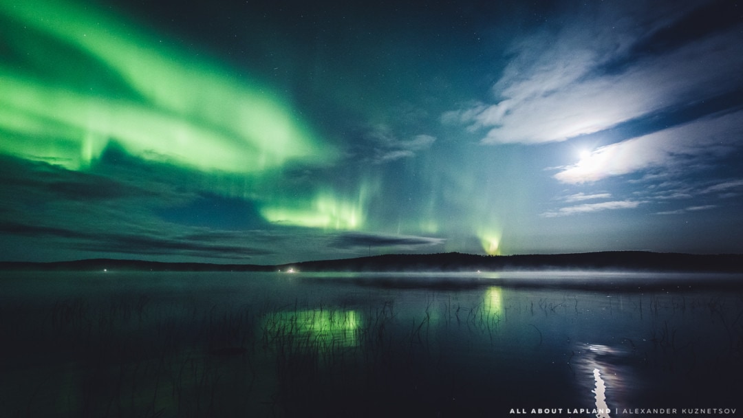 Beautiful northern lights over a lake in September, Rovaniemi Lapland Finland.