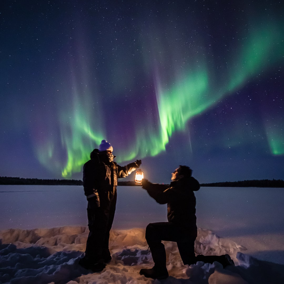 Proposal under the northern lights! Aurora hunting in Rovaniemi Lapland Finland.
